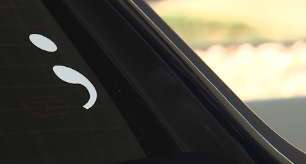 Why do law enforcement vehicles in Wilson County now have semicolons?